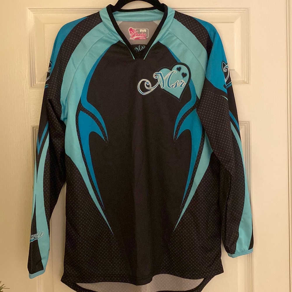Women’s motorcycle bundle. Two new jerseys, knee pads and new googles